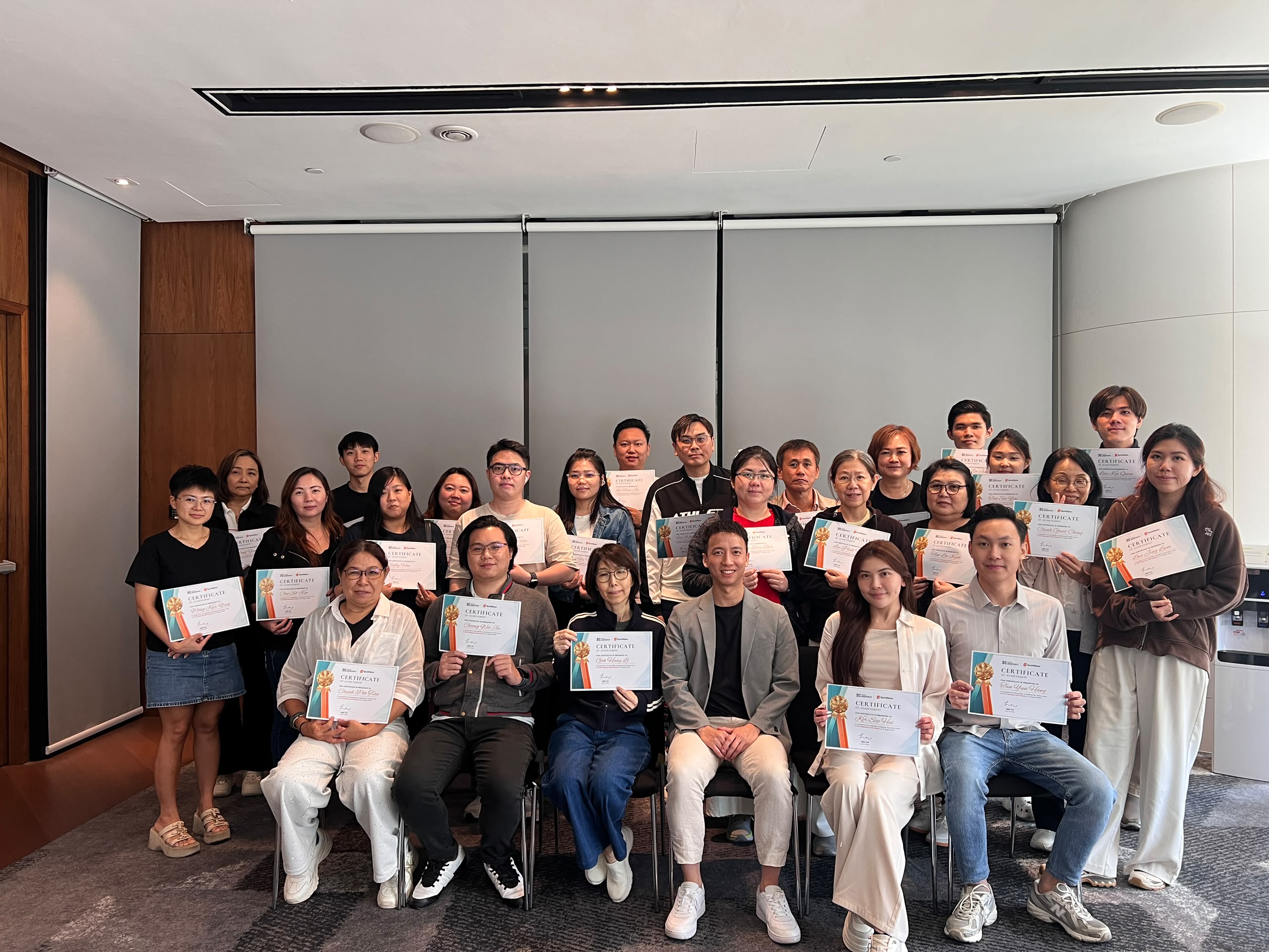 Past participants with their certificates